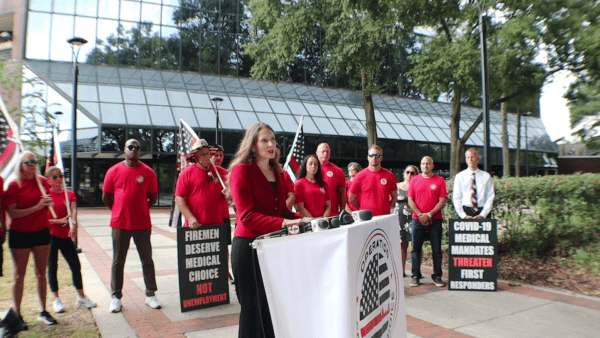 Attorney Rachel Rodriguez speaks about how some Orange County Fire Rescue employees are fighting against vaccine mandates at a press conference in Orlando on Oct. 24, 2021. (Courtesy of Benjamin Frisby)