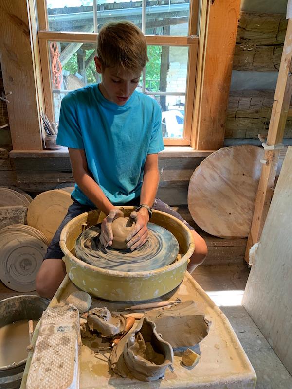 Part of the pottery class includes digging for clay locally and making glazes using math and chemistry. Students take their creations home just in time for Christmas. (Courtesy of BCBS)