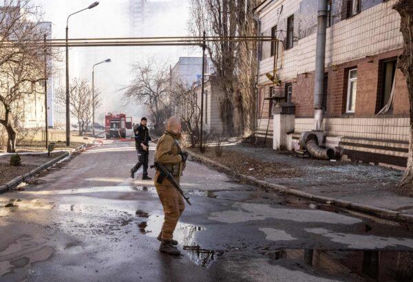 A Ukrainian serviceman walks in the area of a research institute, part of Ukraine's National Academy of Science, after a strike by drones that killed at least one, in northwestern Kyiv, on March 22, 2022. (Fadel Senna/AFP via Getty Images)