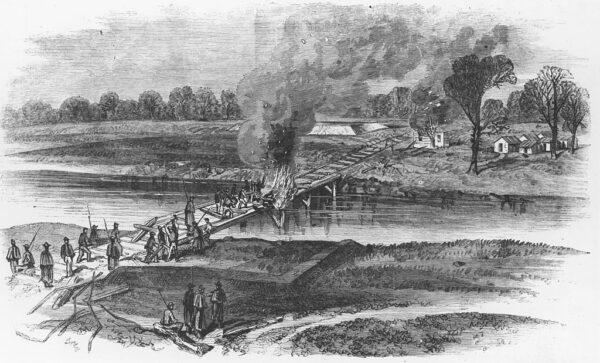 Engraving depicting the destruction of railroad lines and a burning bridge ordered by Union General William T. Sherman to break Confederate communications. Location unknown, USA, circa 1861. (Fotosearch/Getty Images)