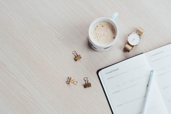 Stock photo of a goal planner notebook on a table. (Content Pixie/Unsplash)