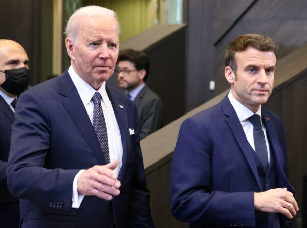 U.S. President Joe Biden (L) and French President Emmanuel Macron arrive to attend a North Atlantic Council meeting during a NATO summit at NATO Headquarters in Brussels on March 24, 2022. (Thomas Coex/AFP via Getty Images)
