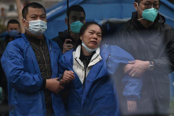 Grieving relatives arrive at the site where China Eastern flight MU5375 crashed on March 21, near Wuzhou, in southwestern China's Guangxi region on March 24, 2022. (Noel Celis/AFP via Getty Images)