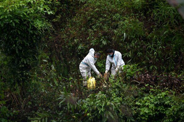 Rescuers work near the site where China Eastern flight MU5375 crashed on March 21, near Wuzhou, in southwestern China’s Guangxi region on March 24, 2022. (Noel Celis/AFP via Getty Images)