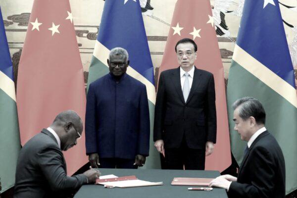 (L-R) Solomon Islands Prime Minister Manasseh Sogavare, Solomon Islands Foreign Minister Jeremiah Manele, Chinese Premier Li Keqiang, and Chinese State Councillor and Foreign Minister Wang Yi attend a signing ceremony at the Great Hall of the People in Beijing, China, on Oct. 9, 2019. (Thomas Peter-Pool/Getty Images)