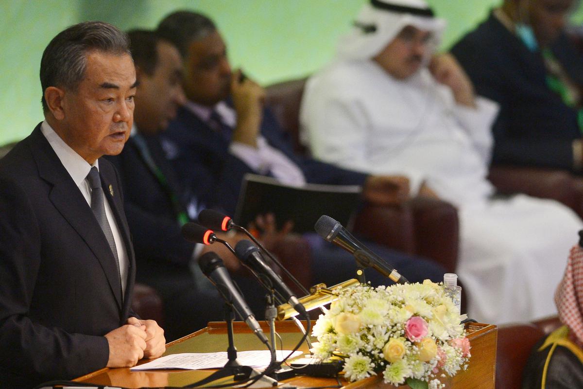 Chinese Foreign minister Wang Yi (L) speaks during the 48th session of the Organization of Islamic Cooperation (OIC) Council of Foreign Ministers, in Islamabad on March 22, 2022. (Farooq Naeem/AFP via Getty Images)