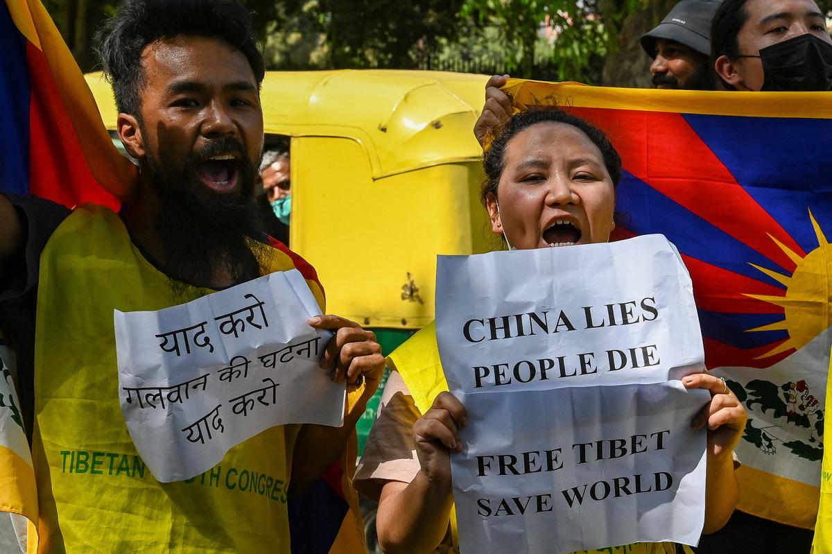 Tibetan Youth Congress activists shout slogans as they protest during China's Foreign Minister Wang Yi visit to India, in New Delhi on March 25, 2022. (Prakash Singh/AFP via Getty Images)