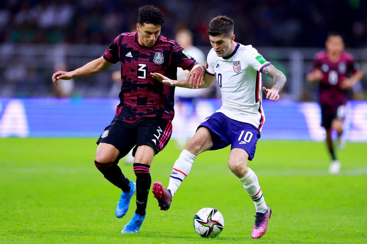 Jorge Sánchez of Mexico fights for the ball with Christian Pulisic of united States during a match between Mexico and United States as part of CONCACAF 2022 FIFA World Cup Qualifiers at Azteca Stadium, in Mexico City, on March 24, 2022. (Hector Vivas/Getty Images)