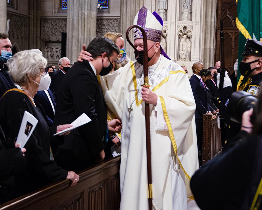 Conor McDonald receives a blessing from Cardinal Timothy Dolan in St. Patrick’s Cathedral at a memorial mass for his father, Steven McDonald. (Dave Paone/The Epoch Times)