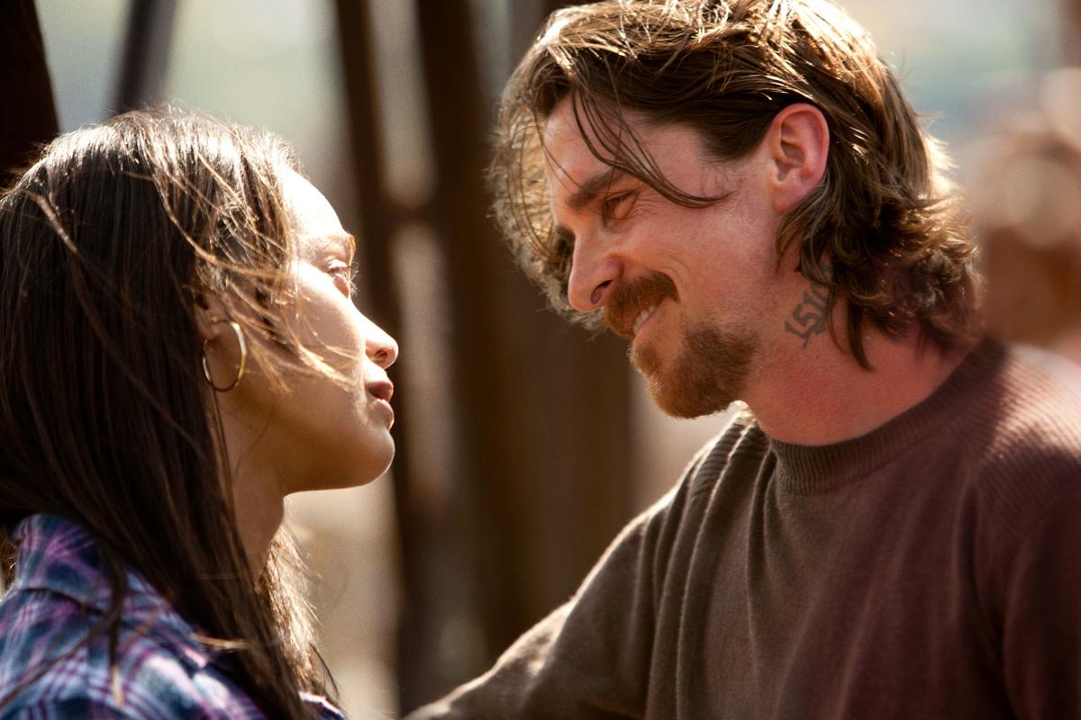Lena Taylor (Zoe Saldana) and Russell Baze (Christian Baze) lament their lost love in "Out of the Furnace." (Relativity Media)