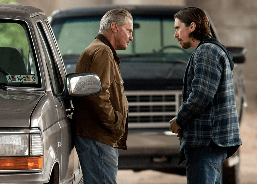 Gerald "Red" Baze (Sam Shepard, L) and his son Russell Baze (Christian Baze) discuss the whereaboust of son/brother Rodney Baze in "Out of the Furnace." (Relativity Media)