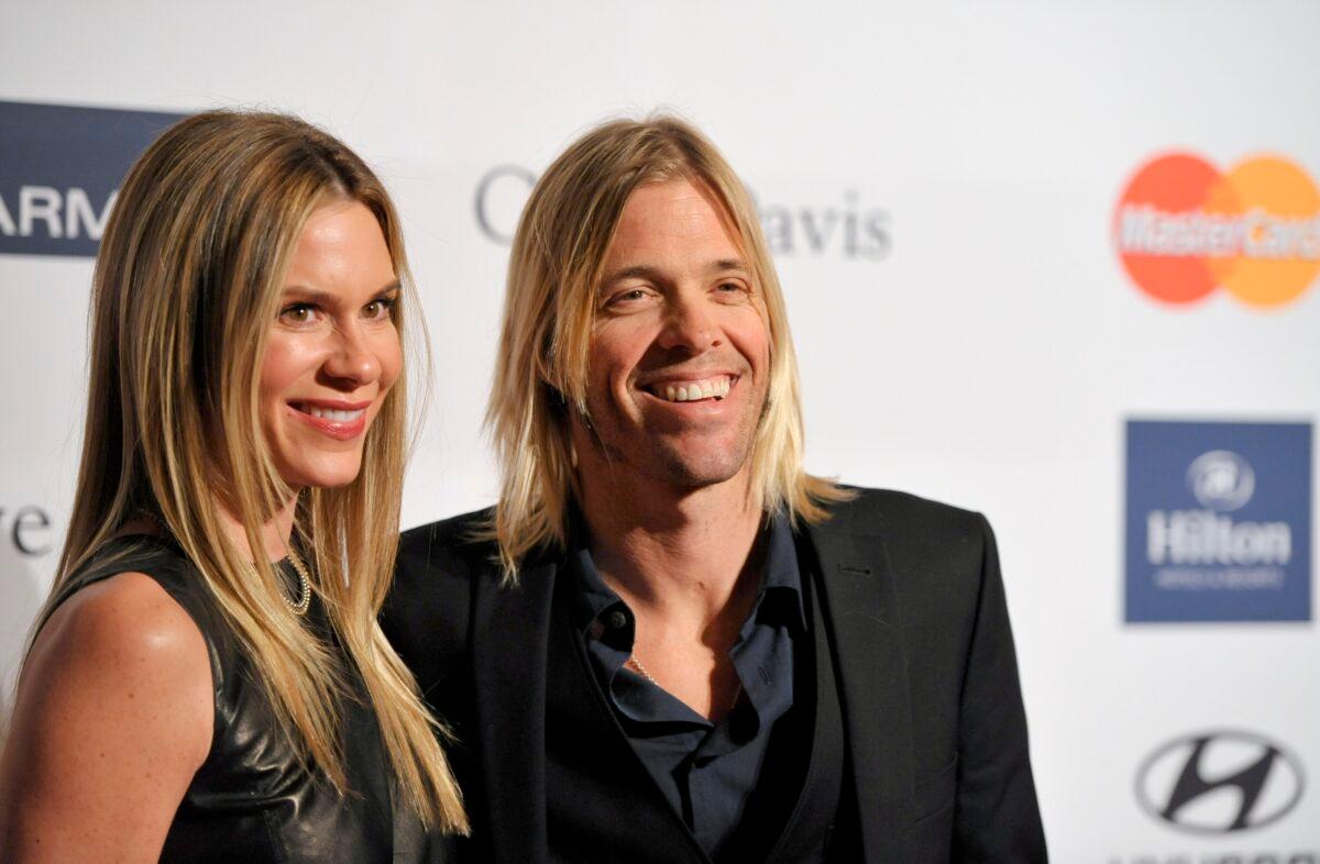 Foo Fighters drummer Taylor Hawkins (R) and Alison Hawkins arrive at the Clive Davis Pre-GRAMMY Gala in Beverly Hills, Calif. on Feb. 9, 2013. (John Shearer/Invision/AP, File)
