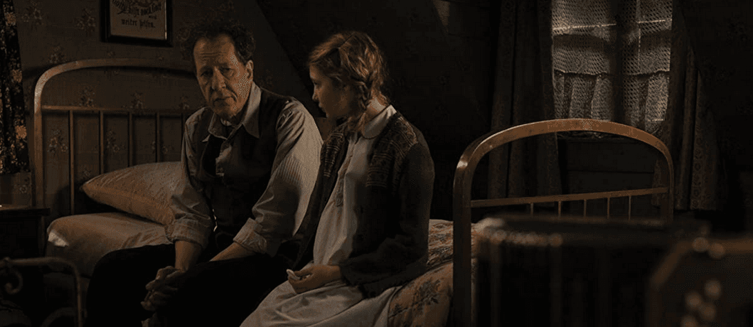 Hans Hubermann (Geoffrey Rush) and Liesel Meminger (Sophie Nélisse) are a father and adopted daughter, in "The Book Thief." (20th Century Fox)