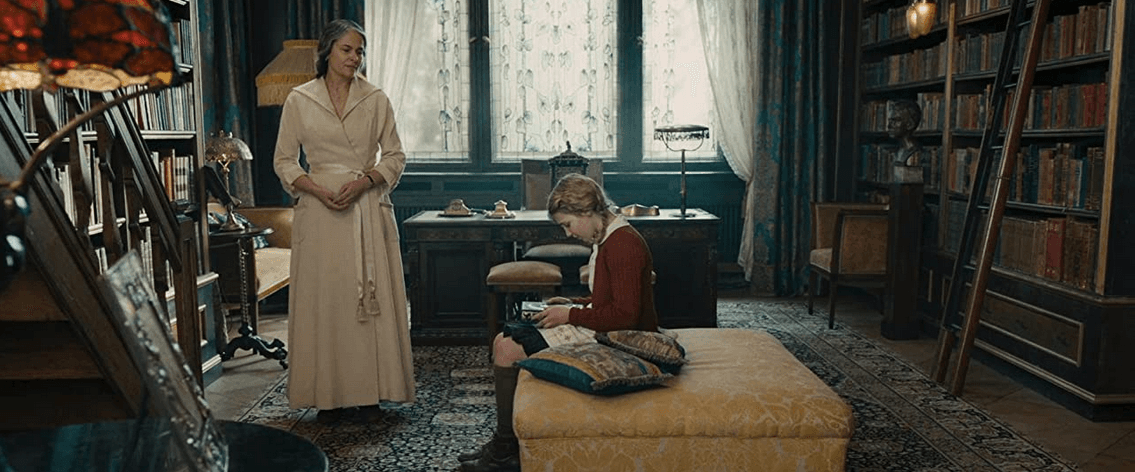 Ilse Hermann (Barbara Auer, L) and Liesel Meminger (Sophie Nélisse) in Frau Hermann's splendid library, in "The Book Thief." (20th Century Fox)
