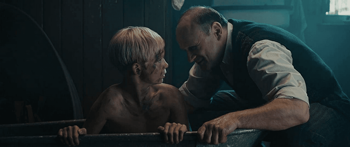 Rudy Steiner (Nico Liersch) being made by his father, Alex (Oliver Stokowski), to wash off black shoe polish, in "The Book Thief." (20th Century Fox)