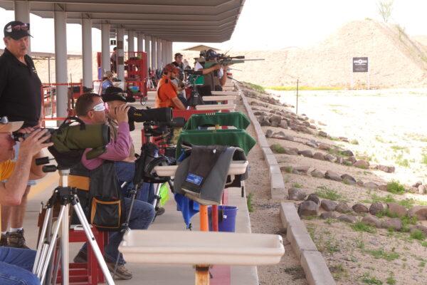 Competitive target shooters prepare to fire during a long-range competition at the Ben Avery Shooting Facility in Phoenix, on March 26. (Allan Stein/The Epoch Times)