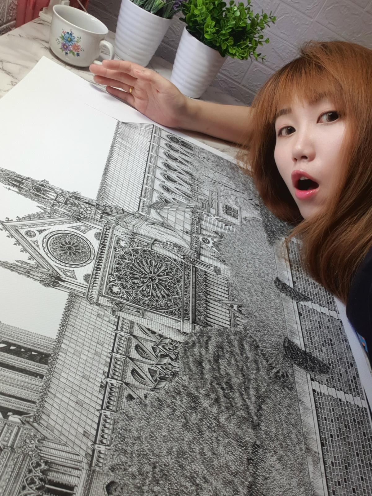 Emi Nakajima with the drawing of Notre Dame de Paris. (Courtesy of <a href="https://www.instagram.com/emi_nkjm/">Emi Nakajima</a>)