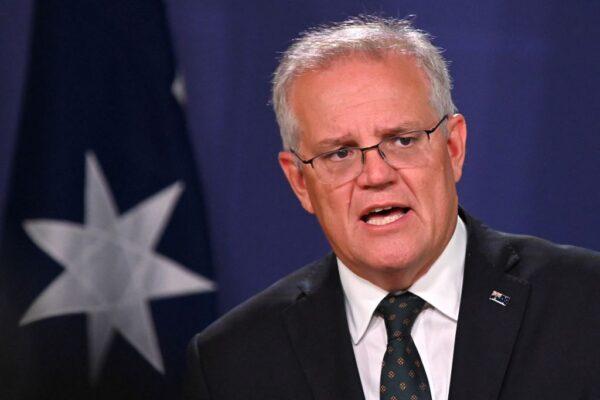 Australia's Prime Minister Scott Morrison speaks to the media to announce sanctions on top Russian officials following the invasion of eastern Ukraine, during a press conference in Sydney, Australia, on Feb. 23, 2022. (Steven Saphore/AFP via Getty Images)