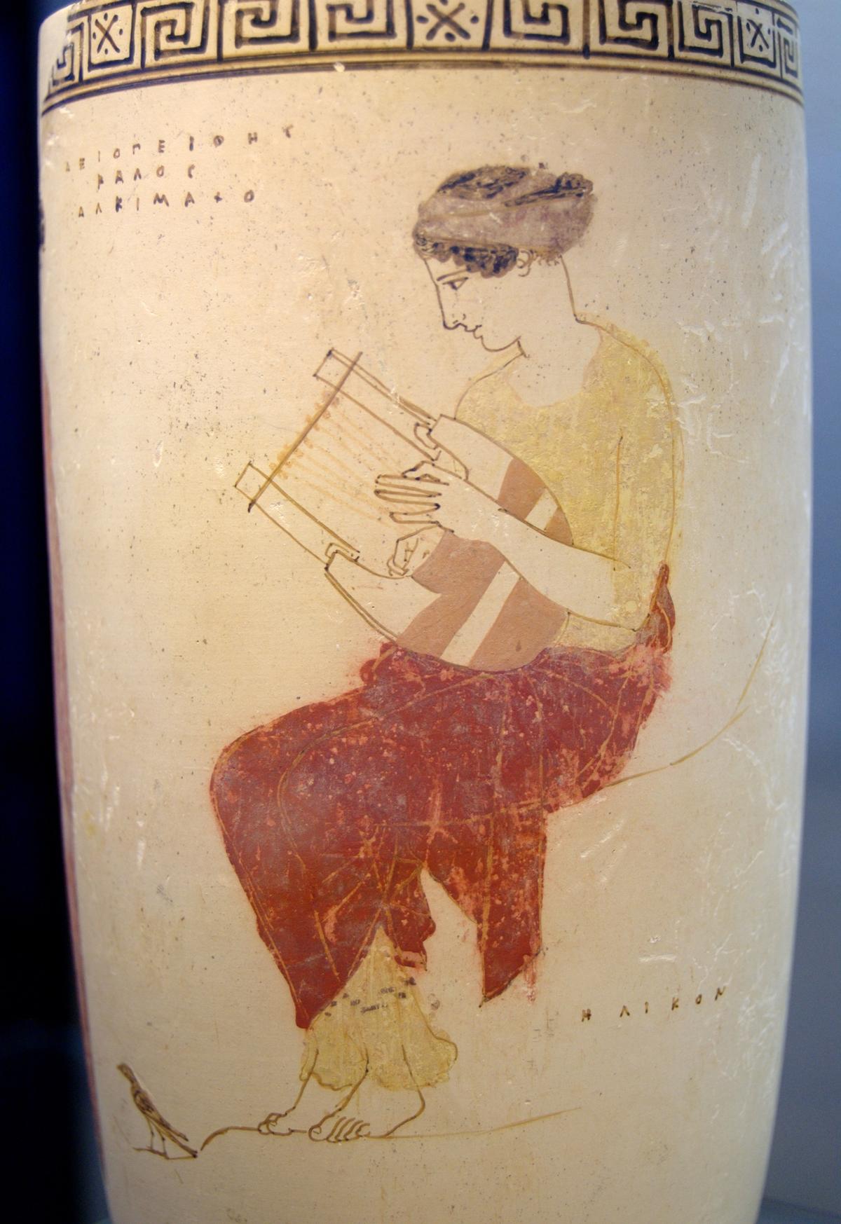 Ancient Greek vase with muse playing a type of lyre (440–430 B.C.). (<a href="https://commons.wikimedia.org/wiki/File:Mousai_Helikon_Staatliche_Antikensammlungen_Schoen80_n1.jpg">Public Domain</a>)