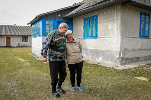 Viktor Pokrovskiy and his wife, Natalia, in their front yard in Koty, Ukraine, on March 25, 2022. (Charlotte Cuthbertson/The Epoch Times)