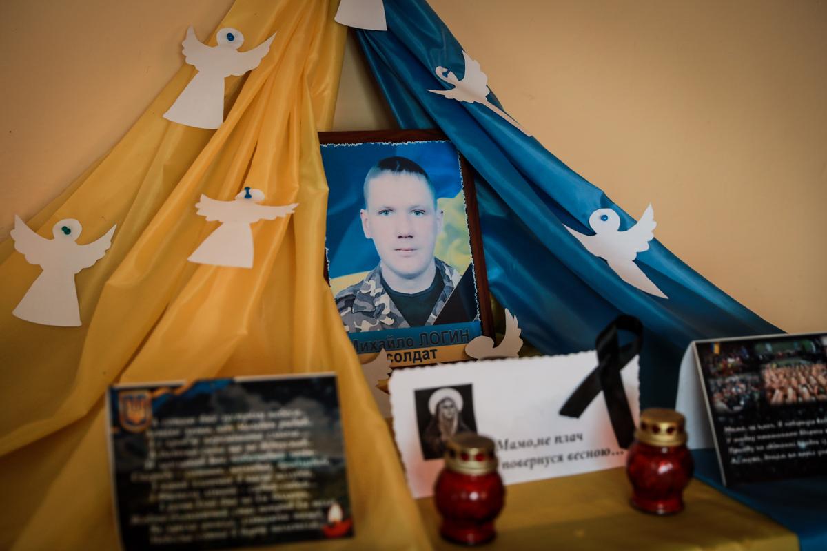 A memorial for Mykhailo Login, a local soldier who was killed in action in 2014 in the conflict with pro-Russian separatists, in Koty, Ukraine, on March 25, 2022. (Charlotte Cuthbertson/The Epoch Times)
