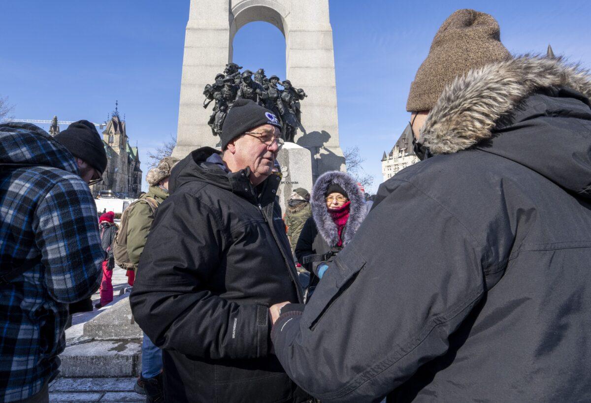 Independent Ontario MPP Randy Hillier greets protesters against federal COVID-19 mandates and restrictions at the War Memorial in Ottawa on Feb. 13, 2022. (The Canadian Press/Frank Gunn)