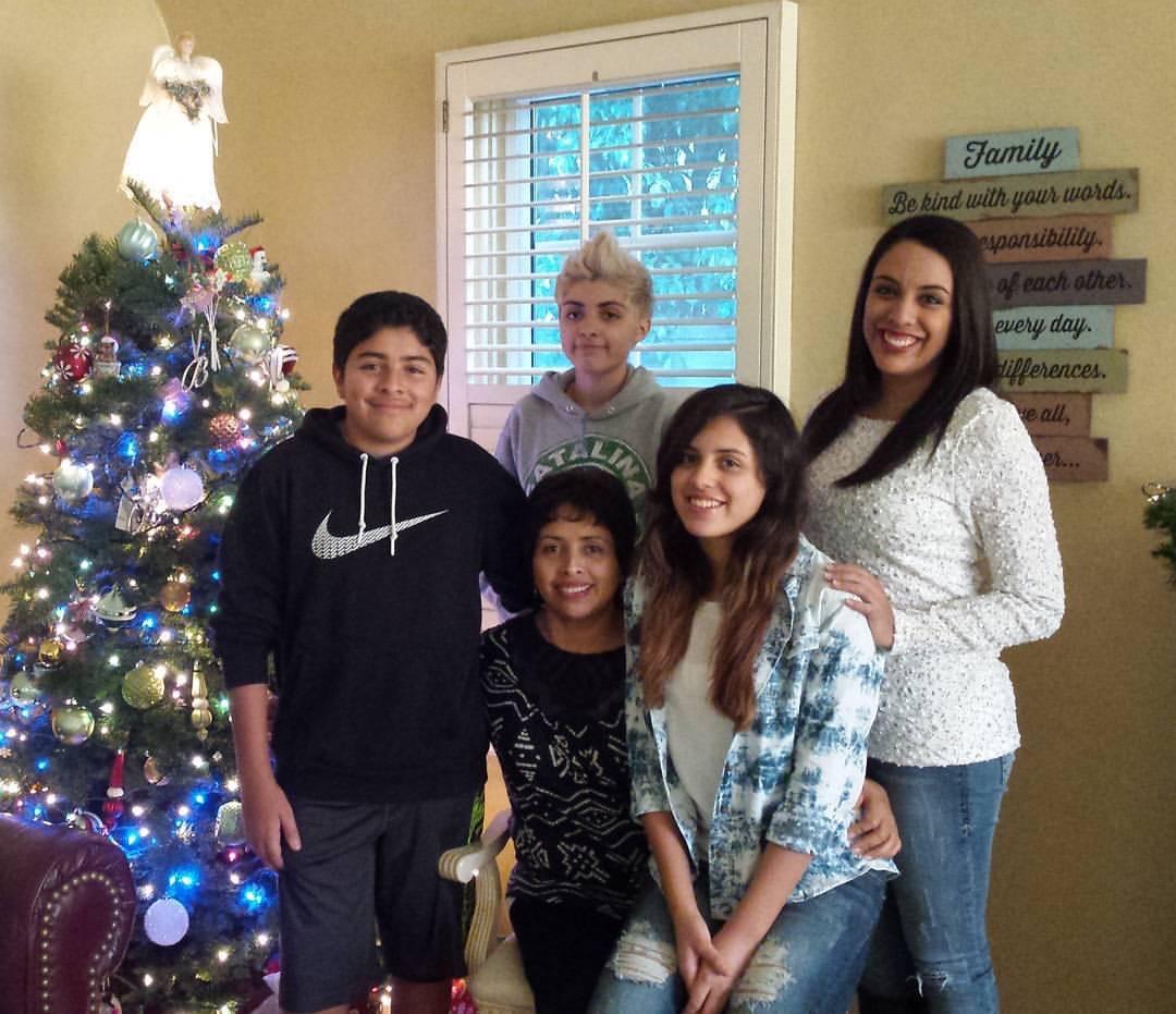 Yaeli Martinez (back C), her mother, Abigail Martinez (seated), and her brother and sisters, in a family photo. (Courtesy of Abigail Martinez)