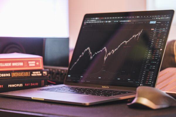 Stock photo of stock chart in a laptop. (Yiorgos Ntrahas/Unsplash)