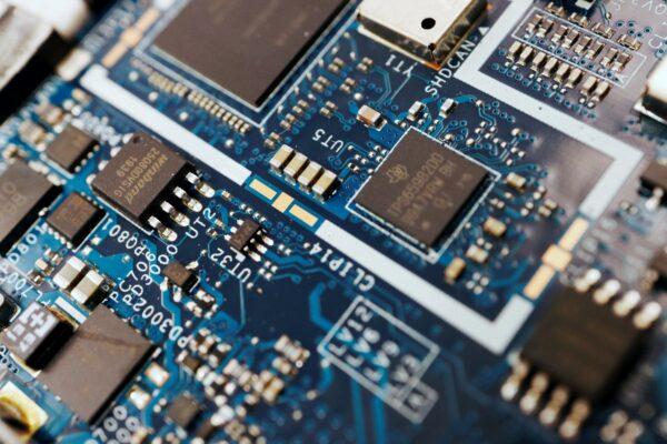 Semiconductor chips on a circuit board of a computer in a photo illustration taken on Feb. 25, 2022. (Florence Lo/Reuters)