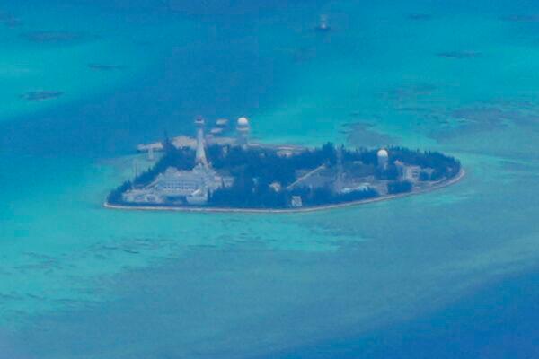U.S. allies are looking to limit the CCP's access to pursue problematic, illegal, and dangerous interests. Chinese structures and buildings at the man-made island on Johnson reef at the Spratlys group of islands in the South China Sea on March 20, 2022. (AP Photo/Aaron Favila)