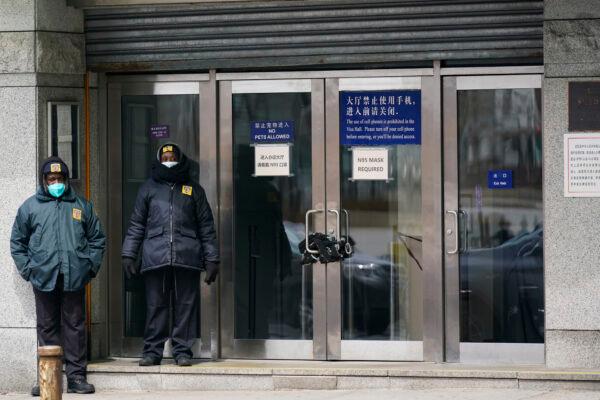 Guards stand outside of the Chinese consulate in New York, on March 28, 2022. (Seth Wenig/AP Photo)