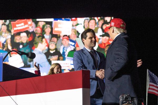 Rep. Matt Gaetz (R-Fla.) shakes hands with former U.S. President Donald Trump during a rally at the Banks County Dragway in Commerce, Ga., on March 26, 2022. (Megan Varner/Getty Images)