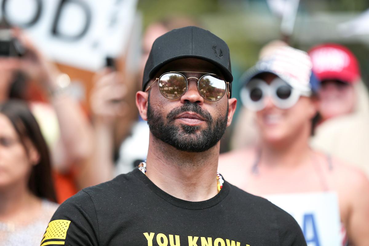 Enrique Tarrio, leader of the Proud Boys, stands outside of the Hyatt Regency where the Conservative Political Action Conference is being held in Orlando, Fla., on Feb. 27, 2021. (Joe Raedle/Getty Images)