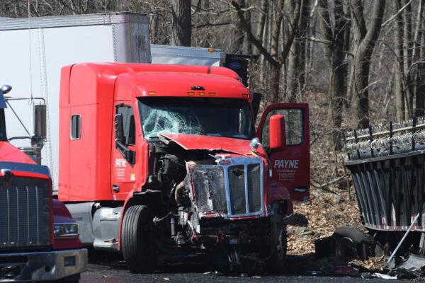 A truck cab is smashed on I-81 north in Foster Township after Monday’s deadly multi-vehicle crash on both I-81 northbound lanes, in Schuylkill County, Pa., on March 29, 2022. (Lindsey Shuey/The Republican-Herald via AP)