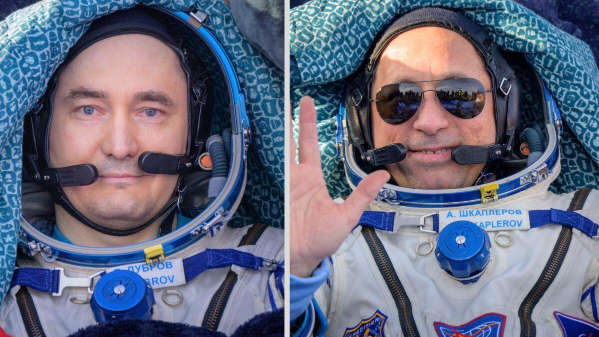 Russian cosmonauts Pyotr Dubrov (L) and Anton Shkaplerov are seen outside the Soyuz MS-19 spacecraft after landing with fellow crew member and NASA astronaut Mark Vande Hei in a remote area near the town of Zhezkazgan, Kazakhstan, on March 30, 2022. (Bill Ingalls/NASA via AP)