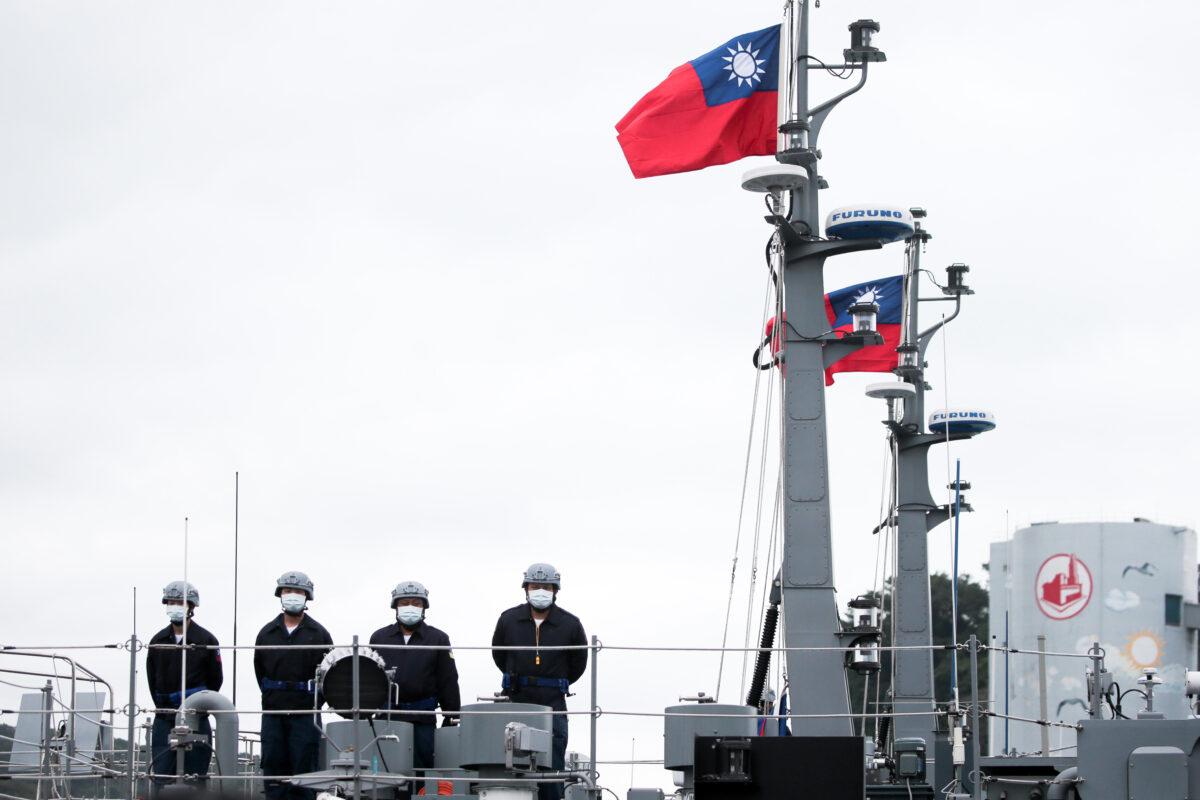 Soldiers stand onboard a Taiwan Navy minelayer in Keelung, Taiwan, on Jan. 7, 2022.  (I-Hwa Cheng/Bloomberg via Getty Images)