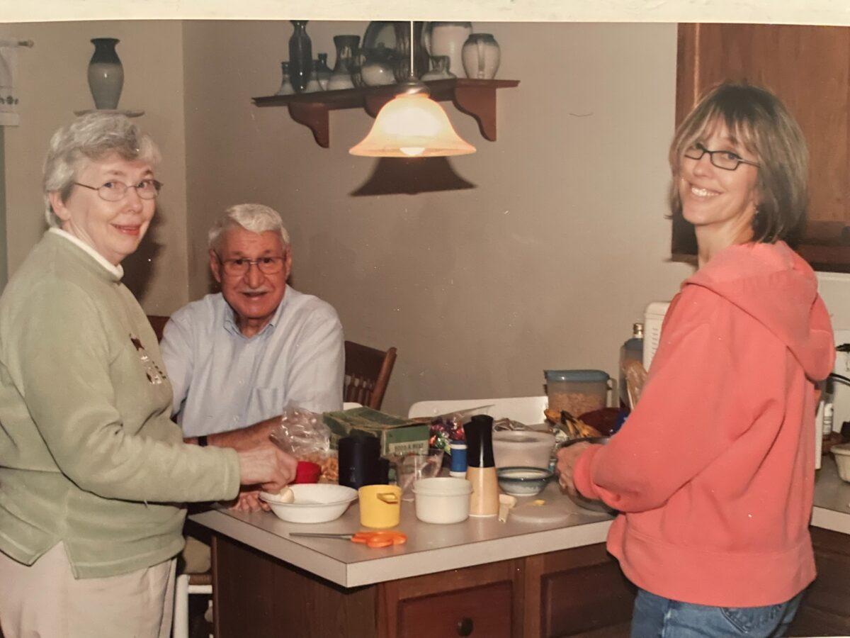 The author (R) with her parents, Alice and Frank Stofan, learns to make Baba's nut rolls for the first time. (Courtesy of Mary Lou Young)