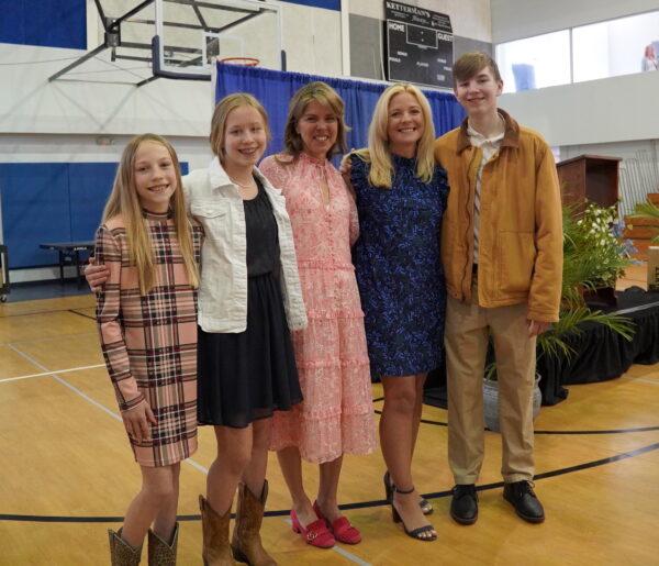 Amy Rogers, a parent of the Evergreen Christian School, with Virginia First Lady Suzanne Youngkin (C) and Rogers's son Tyler (R) and daughters Avery (L) and Kelsey at the school’s dedication ceremony in Leesburg, Va., on Apr. 23, 2022. (Terri Wu/The Epoch Times)