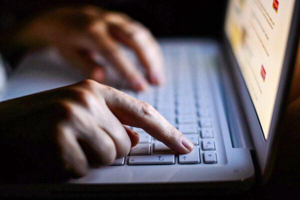Hands on a keyboard in an undated file photo. (PA)