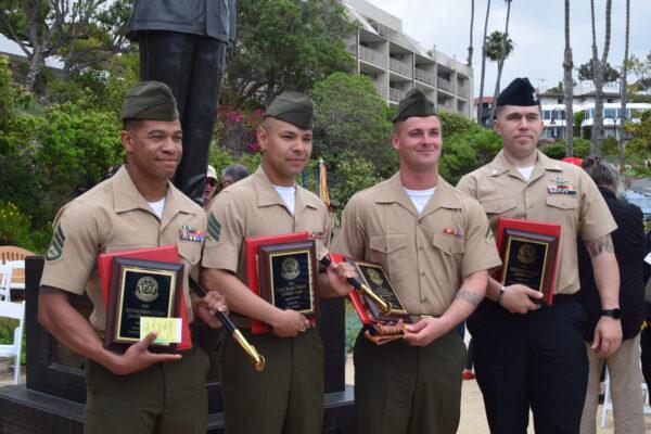 Award recipients pose for a picture during the 2022 Bastard Awards ceremony at Park Semper Fi in San Clemente, Calif., on March 31, 2022. (Brandon Drey/The Epoch Times)