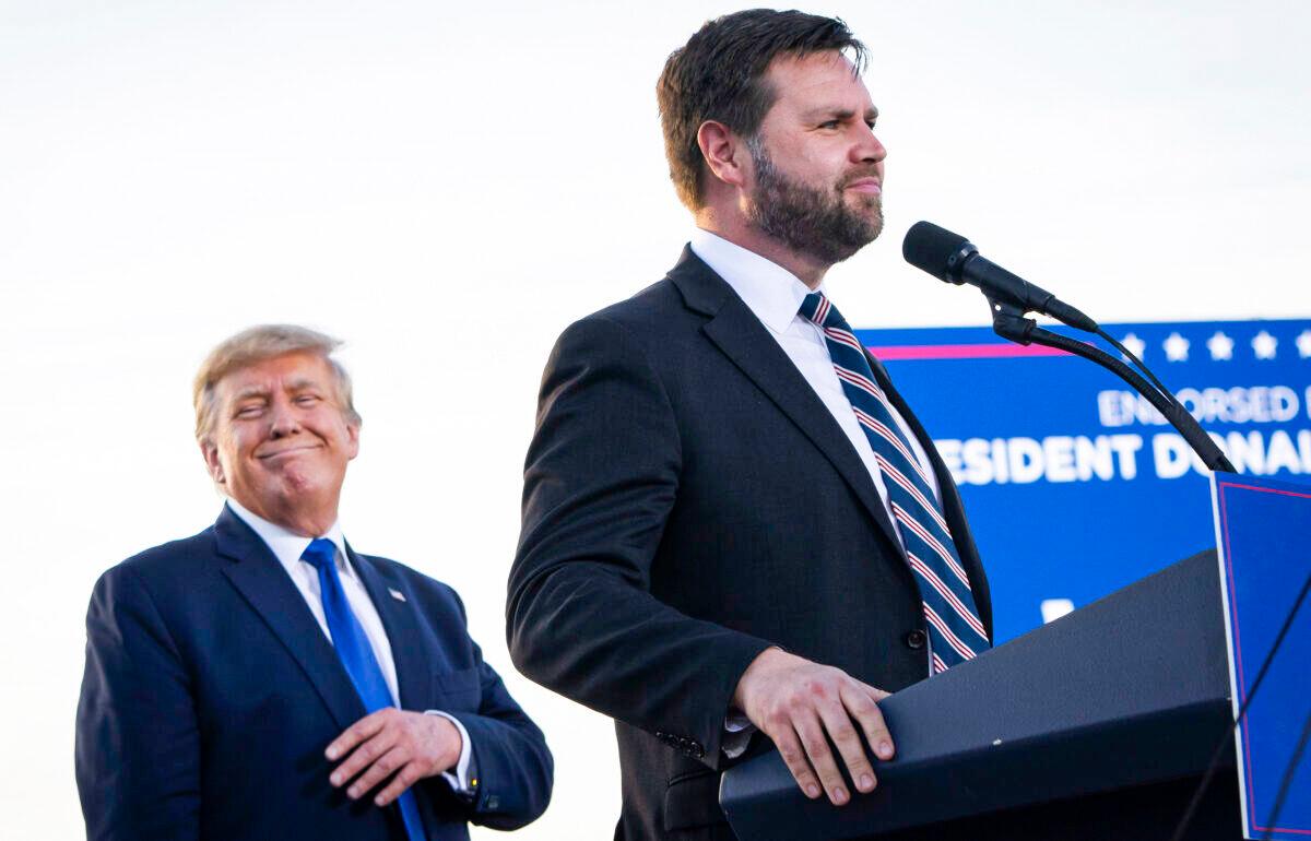 Former president Donald Trump (L) listens as J.D. Vance, a Republican candidate for U.S. Senate in Ohio, speaks during a rally hosted by the former president at the Delaware County Fairgrounds in Ohio on April 23, 2022. (Drew Angerer/Getty Images)