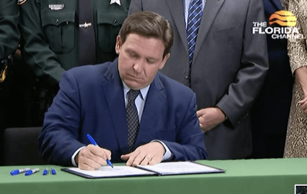 Florida Gov. Ron DeSantis signs HB 3 for law enforcement recruitment and retention on April 1, 2022. (Screen Shot/Courtesy of The Florida Channel)