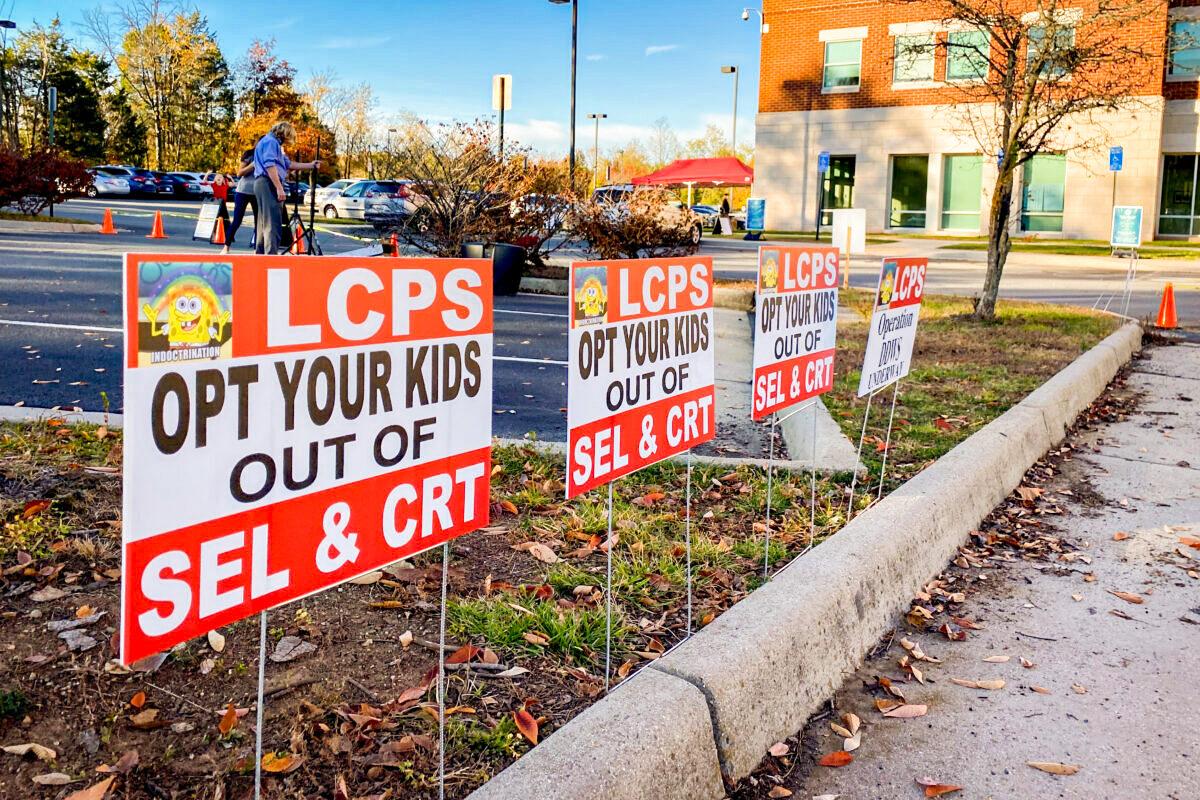 Signs against critical race theory in front of the Loudoun County School District administration building in Virginia on Nov. 9, 2021. (Terri Wu/The Epoch Times)