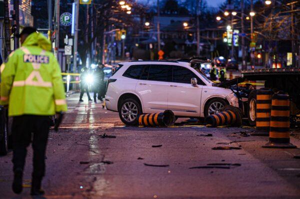 Police attend the scene of a collision in the west end of Toronto on March 31, 2022. (Christopher Katsarov/The Canadian Press)