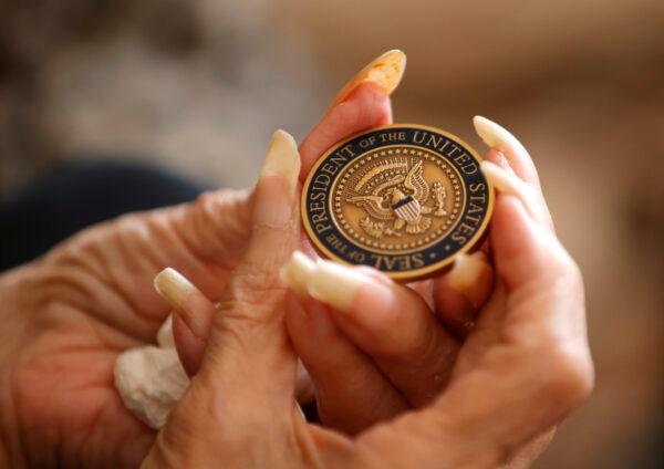Betty Reid Soskin, the oldest full-time National Park Service ranger in the United States, holds a challenge coin that was given to her by former U.S. President Barack Obama in Richmond, Calif., on Sept. 21, 2021. (Justin Sullivan/Getty Images)