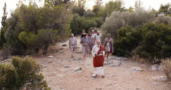 Socrates (Vassilis Tsalis) leads some of his many followers in “Divine Messengers.” (Epoch TV)