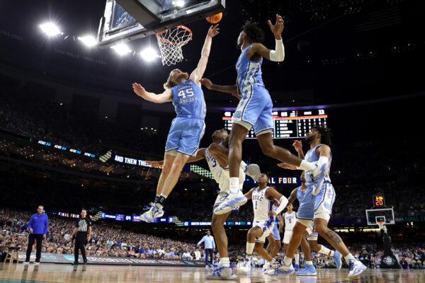 Brady Manek #45 and Leaky Black #1 of the North Carolina Tar Heels jump to gain control of the ball in the second half of the game against the Duke Blue Devils during the 2022 NCAA Men's Basketball Tournament Final Four semifinal at Caesars Superdome, in New Orleans, on April 2, 2022. (Jamie Squire/Getty Images)