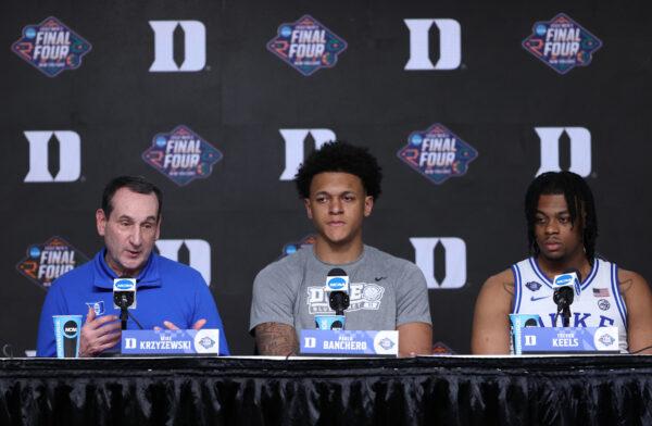 Head coach Mike Krzyzewski of the Duke Blue Devils talks to the press as Paolo Banchero #5 and Trevor Keels #1 look on after losing to the North Carolina Tar Heels 81–77 in the 2022 NCAA Men's Basketball Tournament Final Four semifinal at Caesars Superdome, in New Orleans, on April 2, 2022. (Tom Pennington/Getty Images)