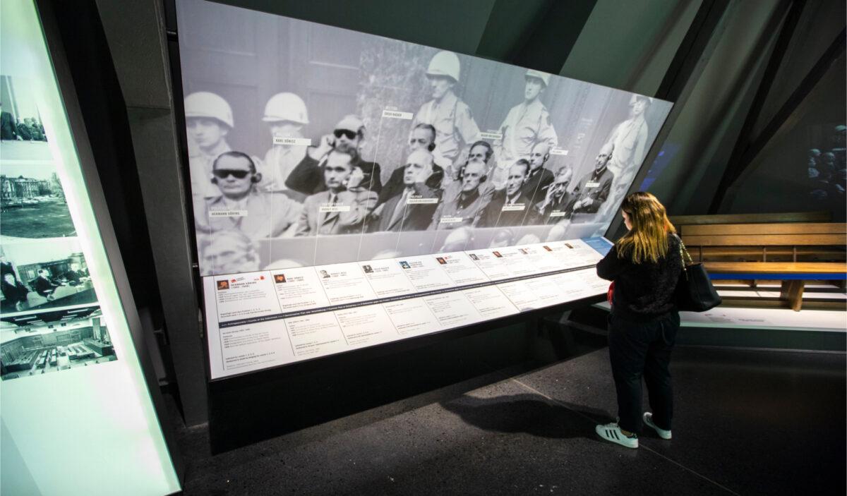 A visitor watches the exhibition at the Memorial to the Nuremberg Trials in Nuremberg, Germany, on Oct. 23, 2019. (chrisdorney/Shutterstock)