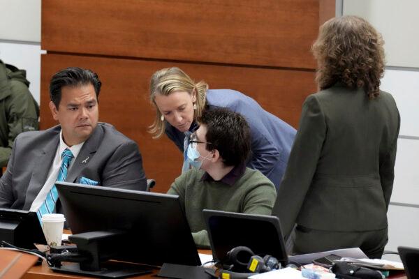 Assistant Public Defender Melisa McNeill advises her client, Marjory Stoneman Douglas High School shooter Nikolas Cruz, as Chief Assistant Public Defender David Wheeler (L) and Assistant Public Defender Tamara Curtis look on during jury pre-selection in the penalty phase of his trial at the Broward County Courthouse in Fort Lauderdale, Fla., on April 4, 2022. (Amy Beth Bennett/South Florida Sun Sentinel via AP, Pool)